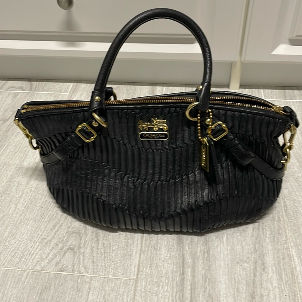 VINTAGE Coach Black leather bag….worn on the shoulder or by hand. gently used
